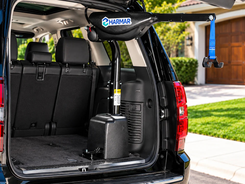 An inside hoist lift with a powered arm mounted in the cargo area of an SUV