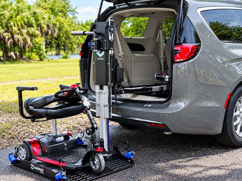 A scooter on an inside hybrid platform lift at the open rear of a minivan