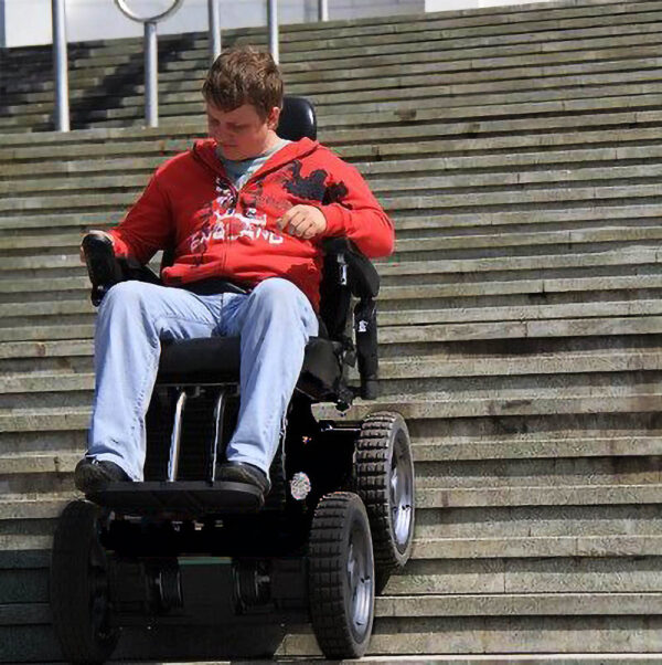 All Terrain PW-4x4Q electric wheelchair with a rugged design, 4-wheel drive system, and advanced suspension for off-road mobility.