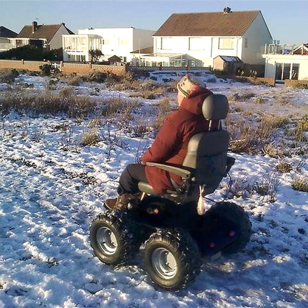 All Terrain PW-4x4Q electric wheelchair with a rugged design, 4-wheel drive system, and advanced suspension for off-road mobility.