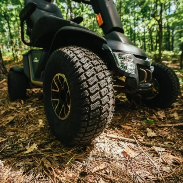 Baja Wrangler 2 all-terrain mobility scooter with large wheels, a padded captain’s seat, and high ground clearance, designed for outdoor use and rugged terrain.