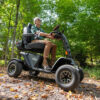 Wrangler 9 Baja Wrangler 2 all-terrain mobility scooter with large wheels, a padded captain’s seat, and high ground clearance, designed for outdoor use and rugged terrain.