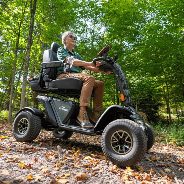 Baja Wrangler 2 all-terrain mobility scooter with large wheels, a padded captain’s seat, and high ground clearance, designed for outdoor use and rugged terrain.
