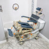 TubBuddy Tilt shower and commode chair with padded seat, adjustable footrests, corrosion-resistant aluminum frame, and tilt-in-space functionality for enhanced comfort.