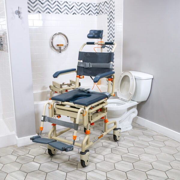 TubBuddy Tilt shower and commode chair with padded seat, adjustable footrests, corrosion-resistant aluminum frame, and tilt-in-space functionality for enhanced comfort.