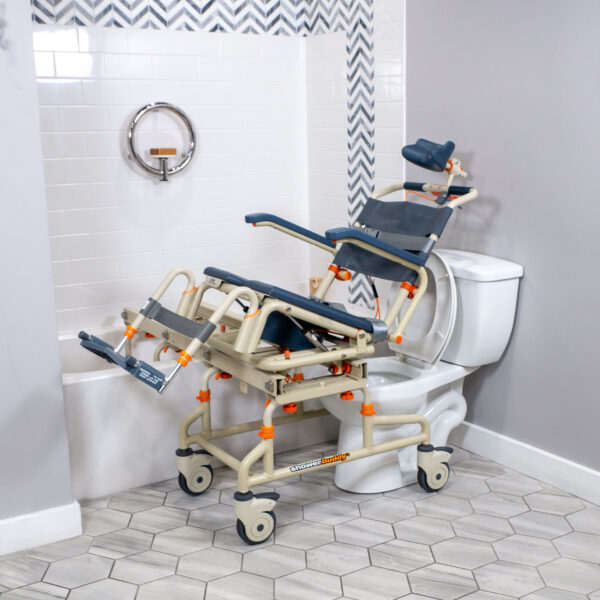 TubBuddy Tilt shower and commode chair with padded seat, adjustable footrests, corrosion-resistant aluminum frame, and tilt-in-space functionality for enhanced comfort.