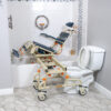 TubBuddy Tilt shower and commode chair with padded seat, adjustable footrests, corrosion-resistant aluminum frame, and tilt-in-space functionality for enhanced comfort.