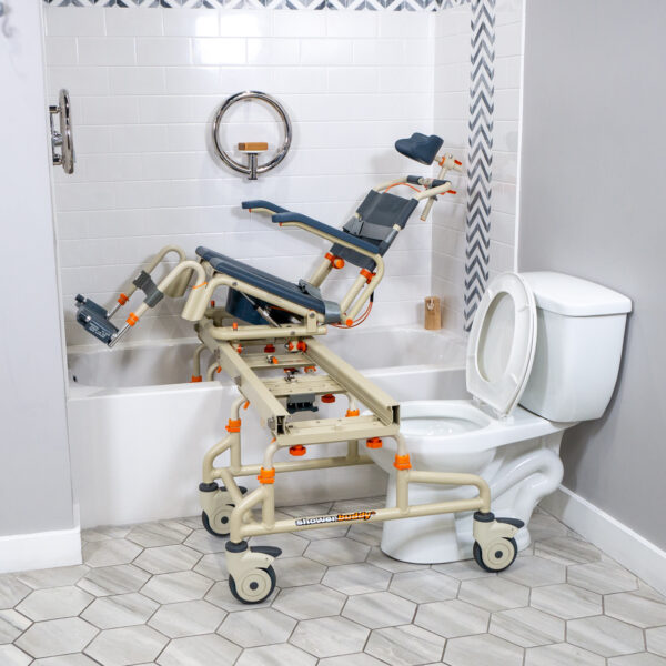 TubBuddy Tilt shower and commode chair with padded seat, adjustable footrests, corrosion-resistant aluminum frame, and tilt-in-space functionality for enhanced comfort.