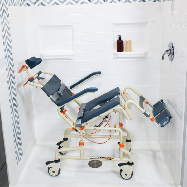 Roll-inBuddy Tilt shower and commode chair with padded seat, headrest, adjustable footrests, and corrosion-resistant frame, designed for enhanced safety and comfort.