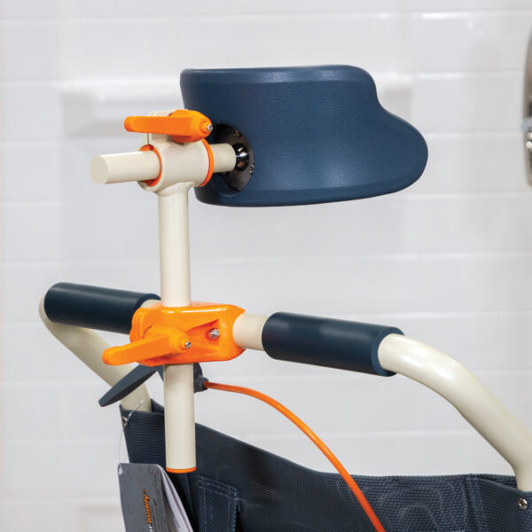 Roll-inBuddy Tilt shower and commode chair with padded seat, headrest, adjustable footrests, and corrosion-resistant frame, designed for enhanced safety and comfort.