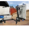 AL 500 3 Harmar AL500 Universal Powerchair Lift with self-tensioning retractors, foldable 26" x 39" aluminum platform, hitch-mounted for easy powerchair transport.