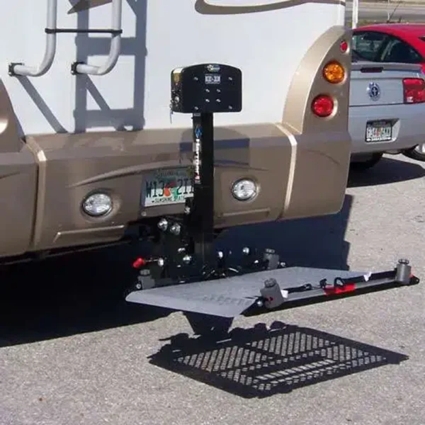 Harmar AL300RV RV Lift mounted on an RV, transporting a scooter with powered lifting and manual fold capabilities.