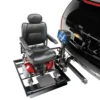 Harmar AL560 Automatic Universal Powerchair Lift mounted to a vehicle, transporting a powerchair with a padded hold-down arm for secure travel.