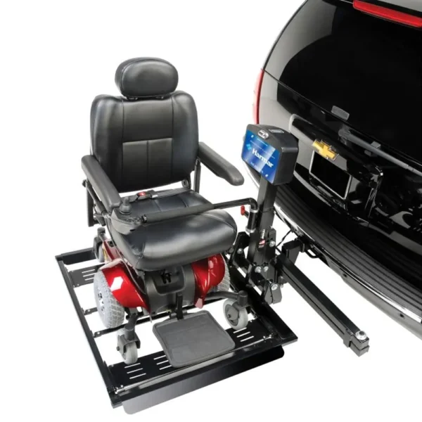 Harmar AL560 Automatic Universal Powerchair Lift mounted to a vehicle, transporting a powerchair with a padded hold-down arm for secure travel.