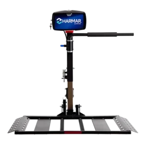 Harmar AL560 Automatic Universal Powerchair Lift mounted to a vehicle, transporting a powerchair with a padded hold-down arm for secure travel.
