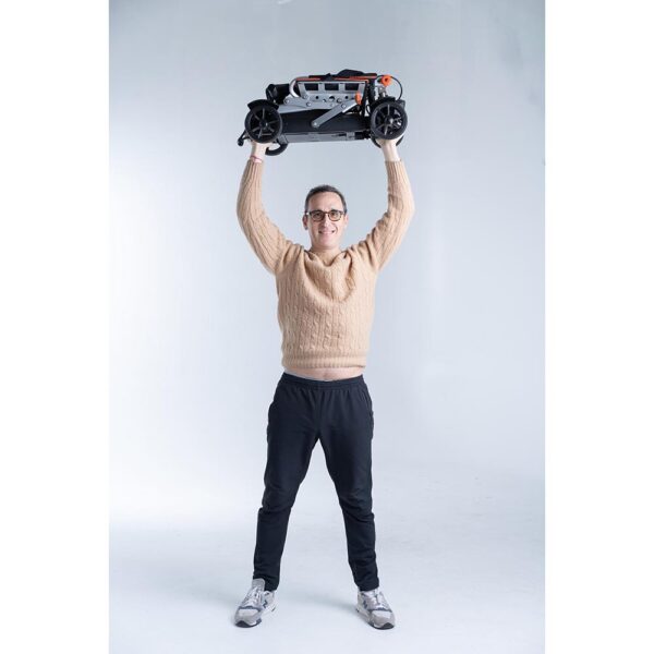 Feather 27X Scooter, ultra-lightweight at 27 lbs, folded compactly for travel, black with red accents, four-wheel design.