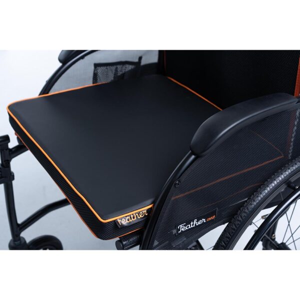 Feather Chair manual wheelchair, ultra-light at 13 lbs, featuring an aluminum frame, large rear wheels, and a foldable design for easy transport and storage.