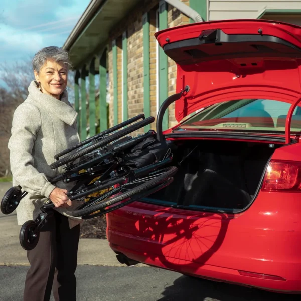 Feather Chair manual wheelchair, ultra-light at 13 lbs, featuring an aluminum frame, large rear wheels, and a foldable design for easy transport and storage.