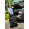 Feather Scooter in black with red trim, lightweight at 37 lbs, foldable design for easy transport and compact storage.
