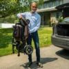 Feather Scooter in black with red trim, lightweight at 37 lbs, foldable design for easy transport and compact storage.