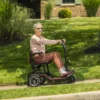 Feather Scooter in black with red trim, lightweight at 37 lbs, foldable design for easy transport and compact storage.