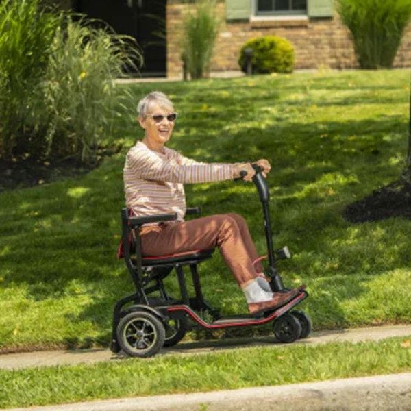 Feather Scooter in black with red trim, lightweight at 37 lbs, foldable design for easy transport and compact storage.