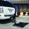 Harmar AL010 Micro Scooter Lift attached to a vehicle, shown with a micro scooter on the platform.