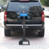 Harmar-AL580_Installed_Straighton_NoChair_lpr Harmar AL580 Power Wheelchair Lift mounted on a vehicle, showcasing compact, powered lifting and securement for mid-wheel drive powerchairs.