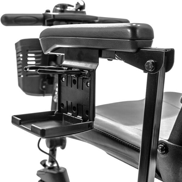 Cup holder attached under the armrest padding of a Pride Mobility scooter, securely holding a beverage for easy access during travel.