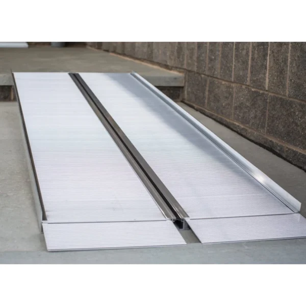 EZ-ACCESS SUITCASE® Singlefold Ramp fully extended, featuring a slip-resistant surface, ergonomic carrying handles, and lightweight aluminum construction, designed for wheelchairs and scooters."