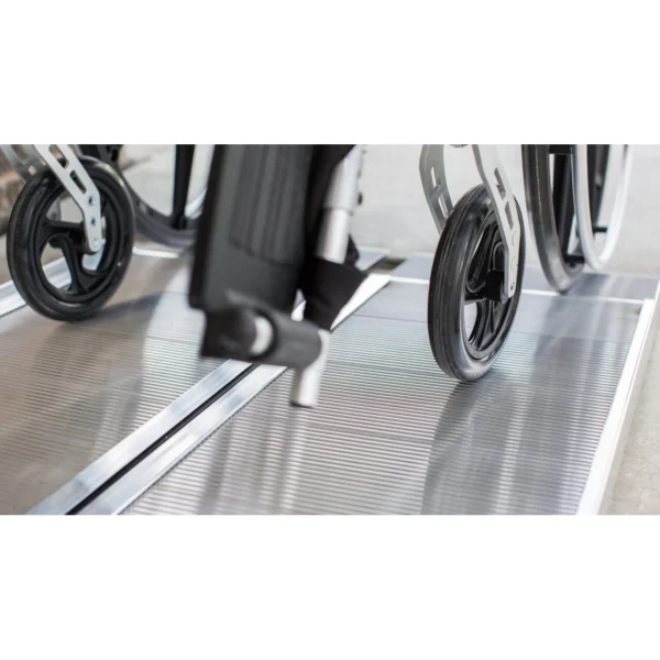 EZ-ACCESS SUITCASE® Singlefold Ramp fully extended, featuring a slip-resistant surface, ergonomic carrying handles, and lightweight aluminum construction, designed for wheelchairs and scooters."