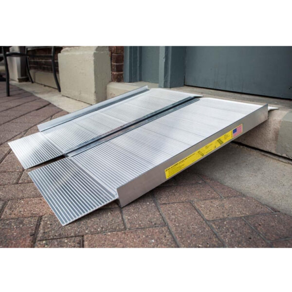 EZ-ACCESS SUITCASE® Singlefold Ramp fully extended, featuring a slip-resistant surface, ergonomic carrying handles, and lightweight aluminum construction, designed for wheelchairs and scooters."