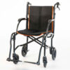 Feather Transport Chair in matte black, ultra-lightweight at 13 lbs, foldable design with padded armrests and flat-free wheels, ideal for indoor and outdoor use.