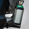 oxygen-tank-holder Oxygen Tank Holder mounted on the back of a Pride Mobility scooter, securely holding an E-sized oxygen tank for easy accessibility.