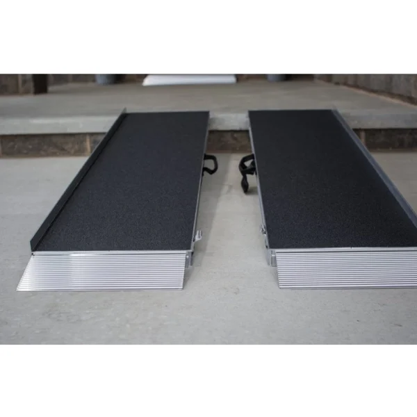 EZ-Access SUITCASE® Advantage Series Ramp folded in half, designed for quick setups and easy transport, providing secure wheelchair and scooter access.