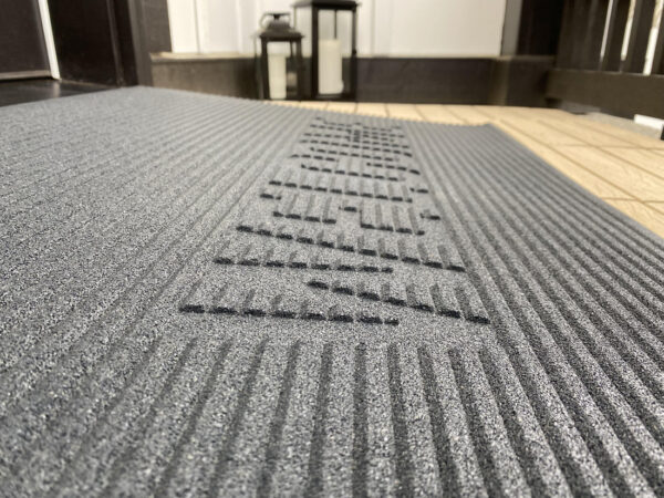 EZ-Access TRANSITIONS® Angled Entry Mat with slip-resistant surface, designed for safe access over raised thresholds for wheelchairs and mobility devices.