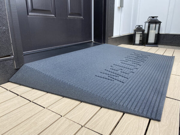 EZ-Access TRANSITIONS® Angled Entry Mat with slip-resistant surface, designed for safe access over raised thresholds for wheelchairs and mobility devices.