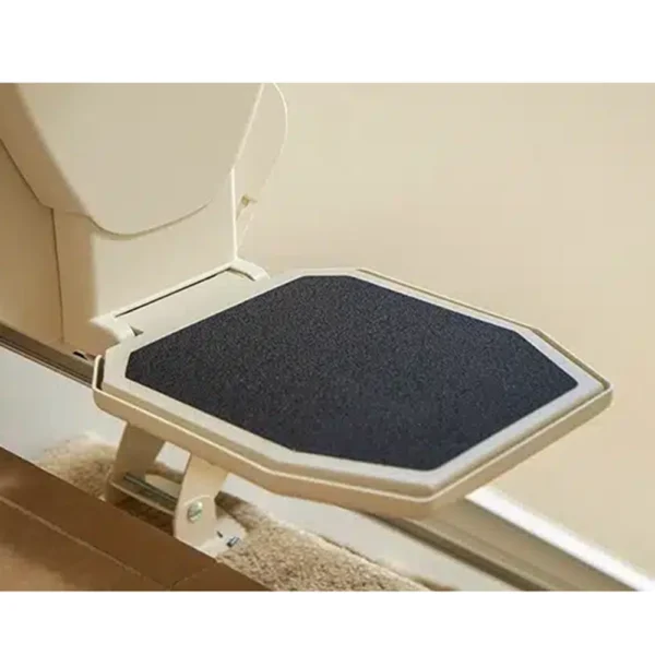 Harmar Pinnacle SL600 Stair Lift installed on a staircase, showcasing its compact folded profile and smooth operation.