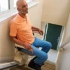 SL600-7600×400-1 Harmar Pinnacle SL600 Stair Lift installed on a staircase, showcasing its compact folded profile and smooth operation.