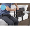 Stander EZ Adjust Bed Rail extended on a bed, showing adjustable length and pivot feature for safe, convenient transfers.