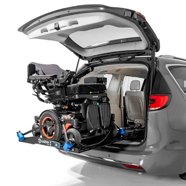 Compact Harmar AL6000 Inside Platform Lift installed in SUV, providing secure transport for powerchairs and scooters.