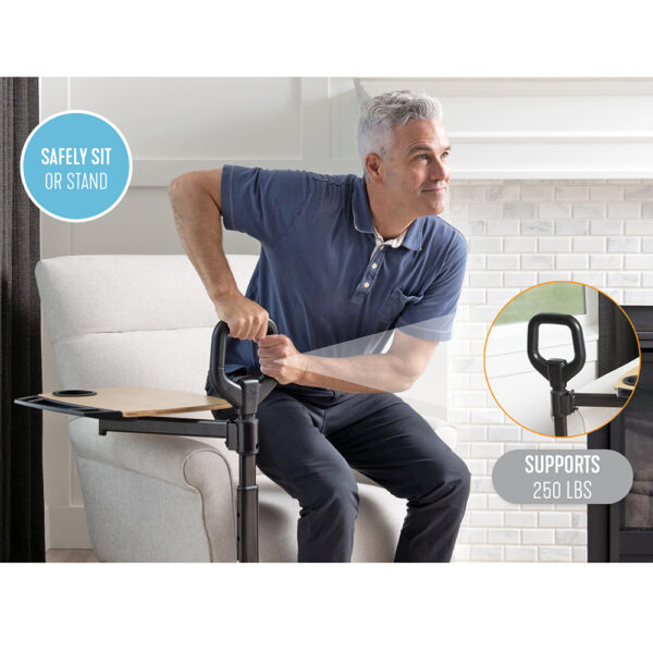 Stander Assist-A-Tray with a swiveling tray and support handle, shown next to a chair for convenient access.