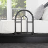 Stander Bed Rail Advantage Traveler, shown folded on a bed, providing secure support for bed transfers at home or on-the-go.