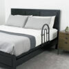 Stander Bed Rail Advantage Traveler, shown folded on a bed, providing secure support for bed transfers at home or on-the-go.