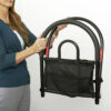 Stander Bed Rail Advantage Traveler, shown folded on a bed, providing secure support for bed transfers at home or on-the-go.