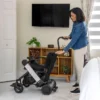 Cane Holder for Model F 3 Cane Holder Kit securely attached to WHILL Model F, providing convenient cane storage for easy access.