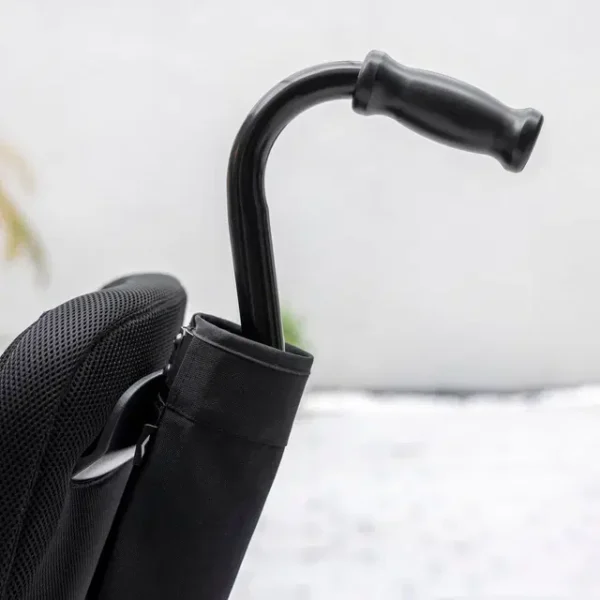 Cane Holder Kit securely attached to WHILL Model F, providing convenient cane storage for easy access.