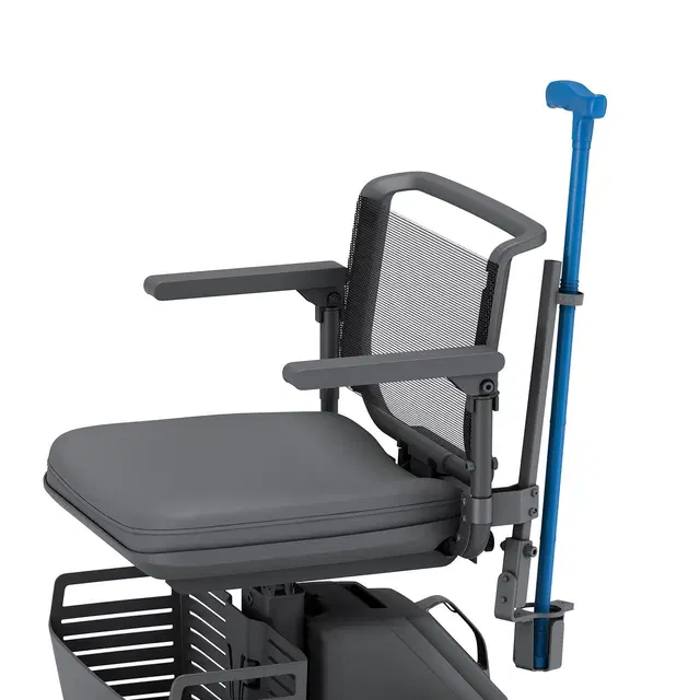 Cane Holder attached to the WHILL Model Ri, holding a cane securely for convenient access.