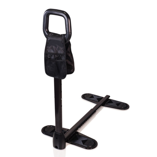 Stander Couch Cane beside a couch, showing the adjustable handle and organizer pouch for convenient support.