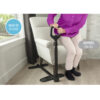 Stander Couch Cane beside a couch, showing the adjustable handle and organizer pouch for convenient support.